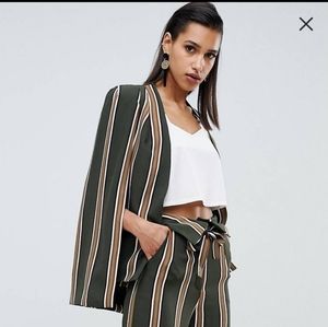 Cape and trouser suit!